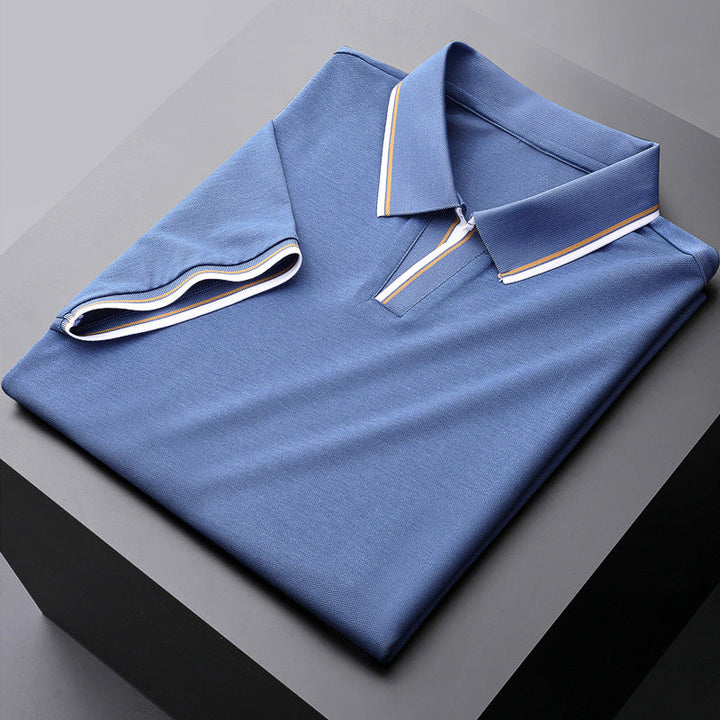 Men's wardrobe staple collared polo shirt, short sleeve design with contrast trim for versatile styling.