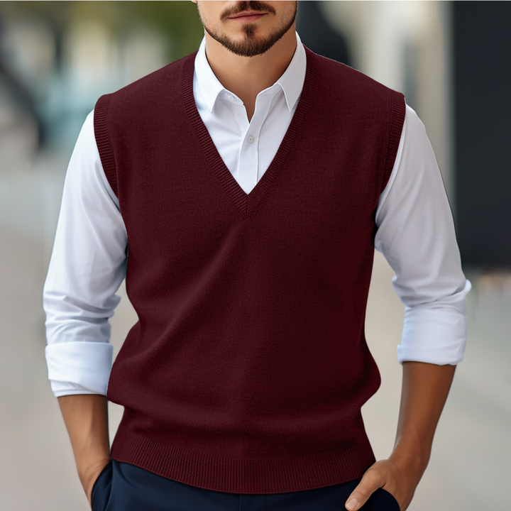 Detailed shot of the V-neck collar on a men's knitted cotton gilet, perfect for layering
