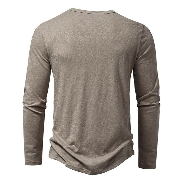 Comfortable men's long sleeve henley shirt in a slim fit, perfect for versatile everyday casual wear.