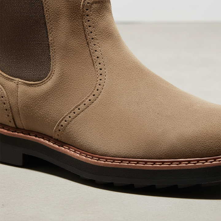 Black faux leather men's Chelsea boots, easy slip-on style, ideal for versatile autumn footwear.