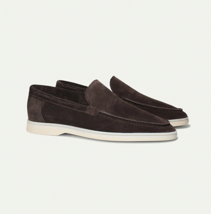 Men's classic leather slip-on loafers worn for effortless style, showcasing comfortable and versatile footwear.