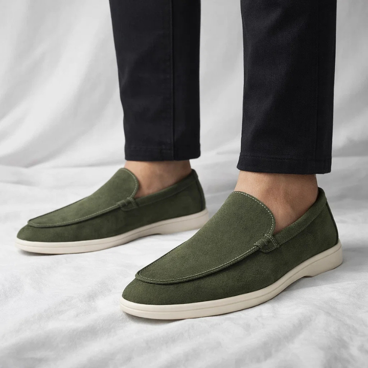 Men's classic loafers worn, showcasing comfortable & stylish everyday footwear. Easy slip-on shoes.
