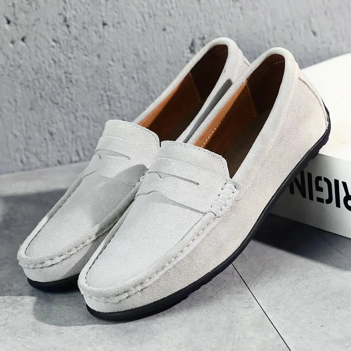 Experience all-day comfort and timeless style with these men's classic slip-on loafers.
