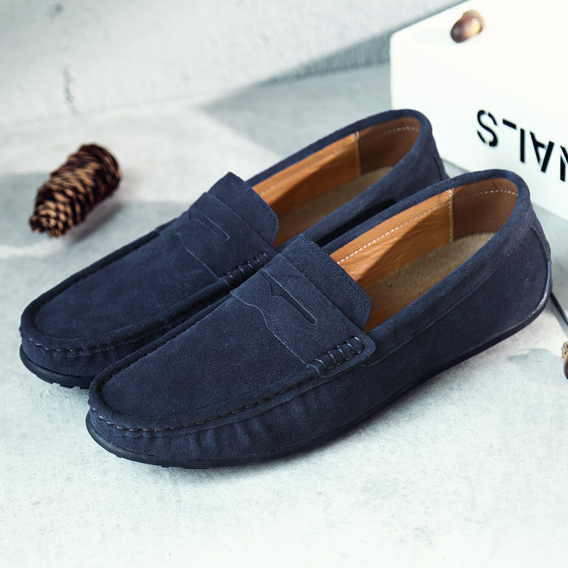 Close-up of men's classic slip-on loafers, showcasing comfortable design & elegant finish.
