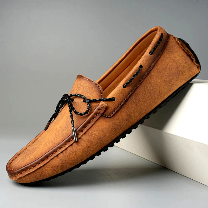 Men's classic slip-on loafers with a polished finish, perfect for sophisticated dress or casual style.