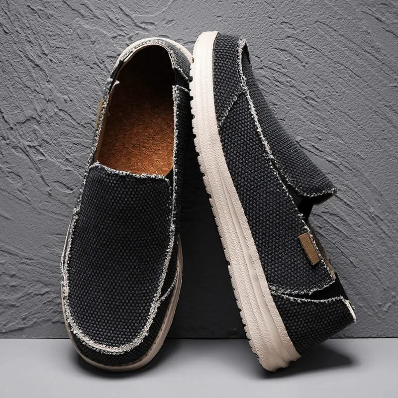 Grey men's classic slip-on loafers, durable and comfortable footwear for casual occasions. Easy to wear.