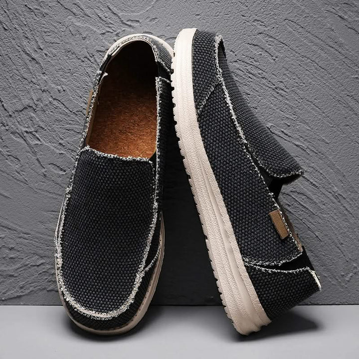 Grey men's classic slip-on loafers, durable and comfortable footwear for casual occasions. Easy to wear.