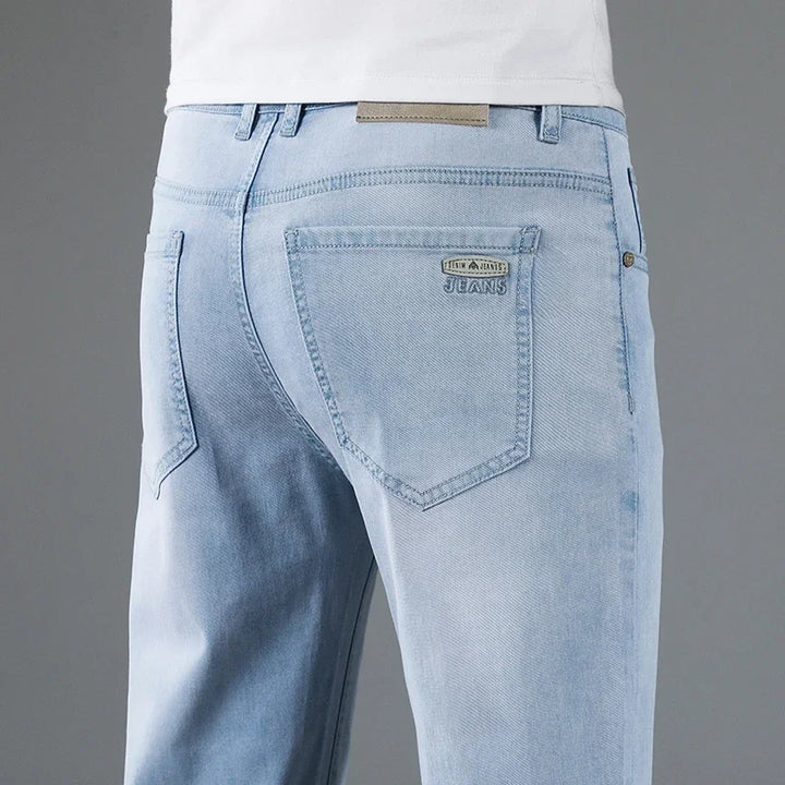 Straight fit men's denim jeans, offering a classic and comfortable style for daily fashion and versatility.