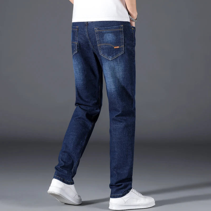 Durable men's straight leg jeans in classic blue, offering relaxed comfort & timeless style for everyday wear.