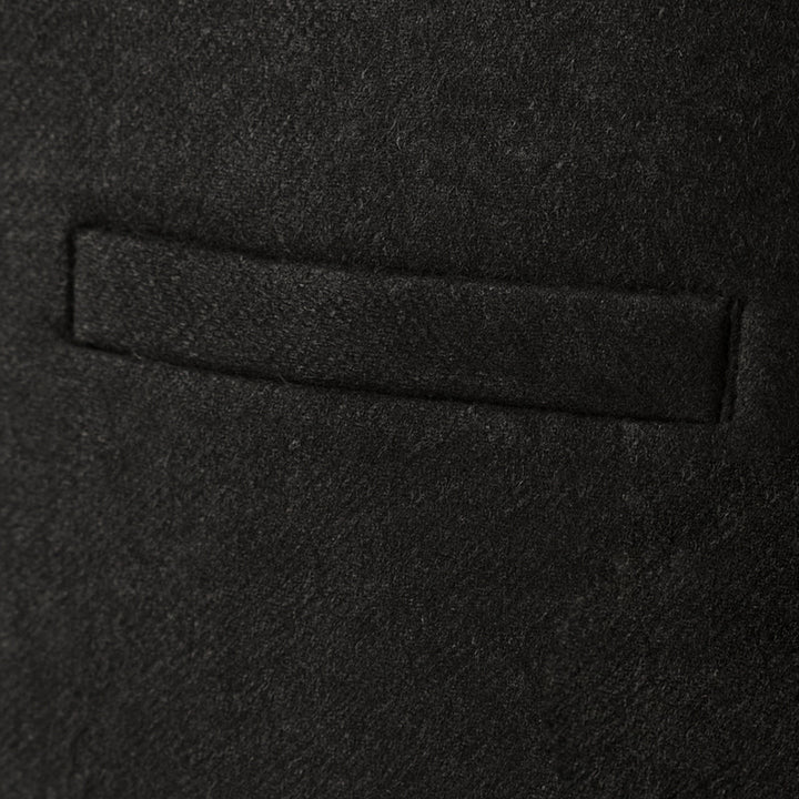 Side profile of a men's classic tailored waistcoat, showcasing its perfect fit and elegant silhouette.