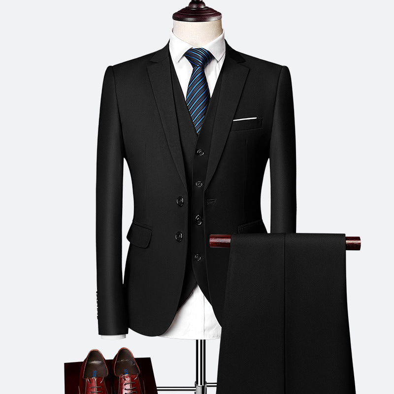 Elegant men's three-piece suit, tailored for a slim fit. Includes jacket, waistcoat, & trousers. Perfect formal wear.