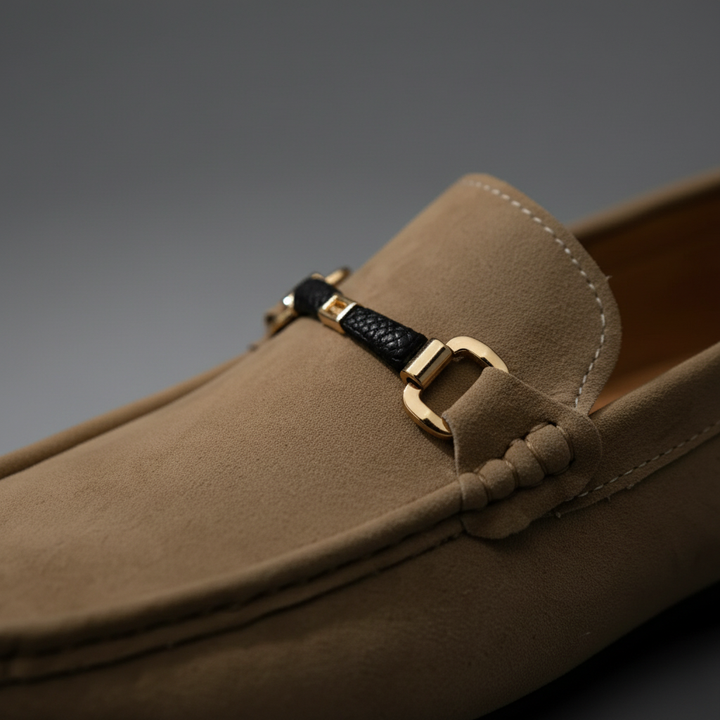 Close-up of classic tan leather men's loafers, highlighting the comfortable slip-on design and quality stitching.