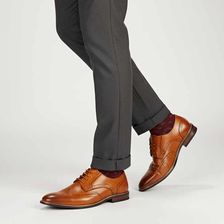 Pair of men's premium wingtip brogue oxford shoes, displaying intricate design and quality craftsmanship