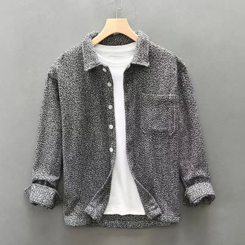 Grey men's casual textured long-sleeve button-down shirt with a classic design. Relaxed fit for versatile style.