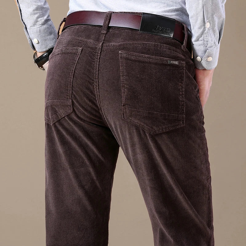 Men's classic textured dark blue straight-leg jeans, tailored fit for versatile everyday fashion.
