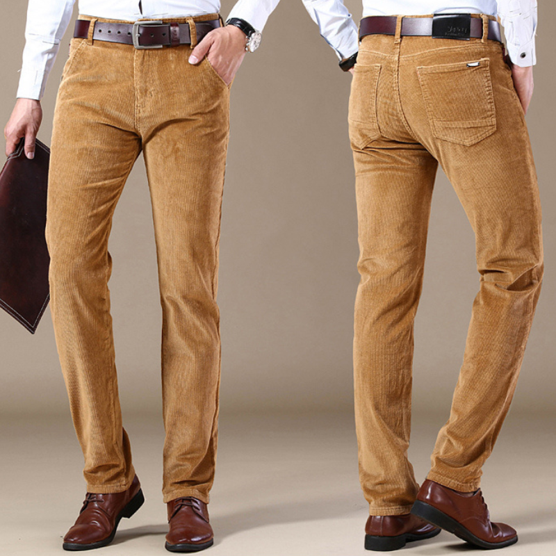 Waistband and button detail of men's classic textured jeans, showcasing tailored fit and quality.
