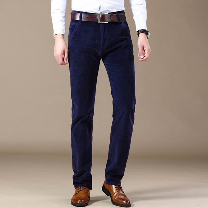 Model posing in black classic textured straight-leg jeans, showcasing everyday fashion and fit.