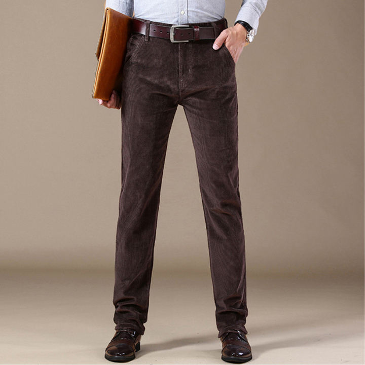 Close-up: Textured finish on men's dark blue classic straight-leg jeans, durable and stylish.