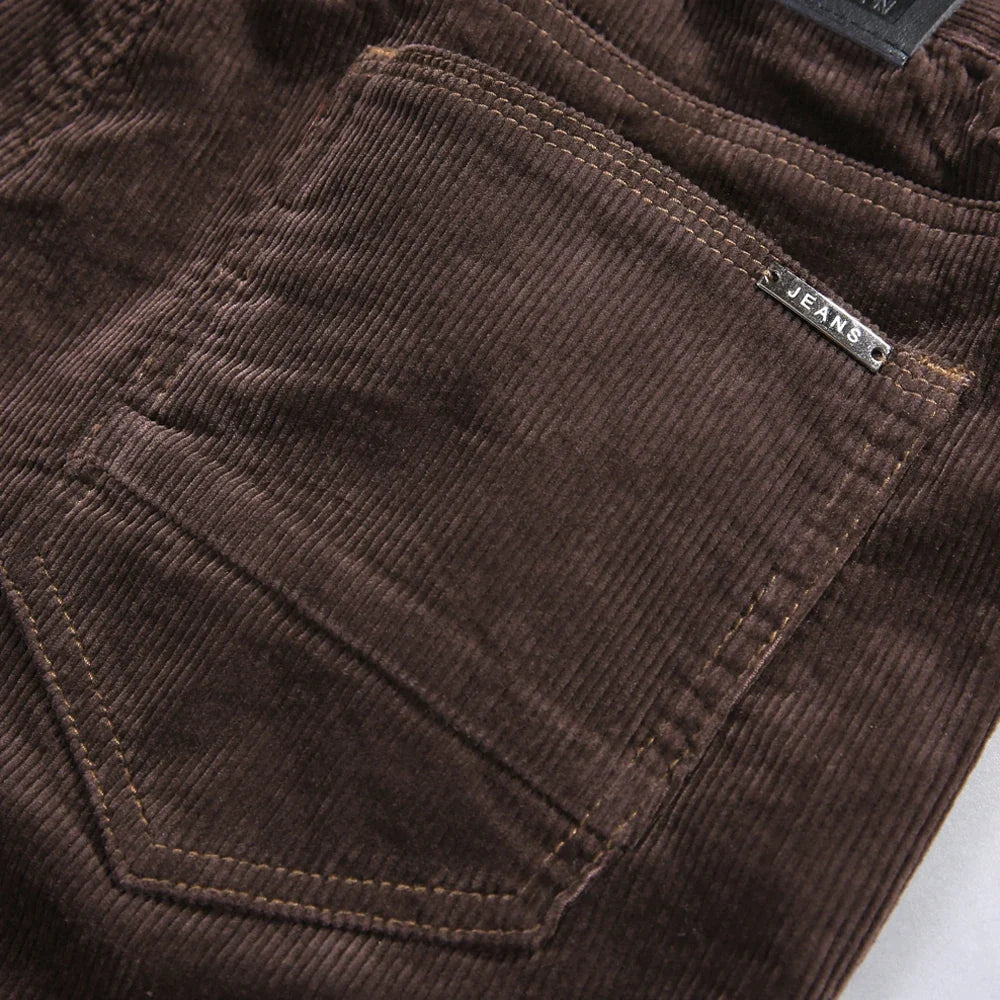 Brown men's classic textured straight-leg jeans, durable and comfortable for versatile casual wear.