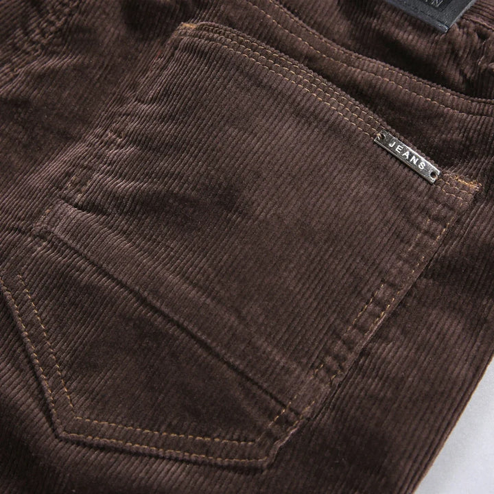 Brown men's classic textured straight-leg jeans, durable and comfortable for versatile casual wear.