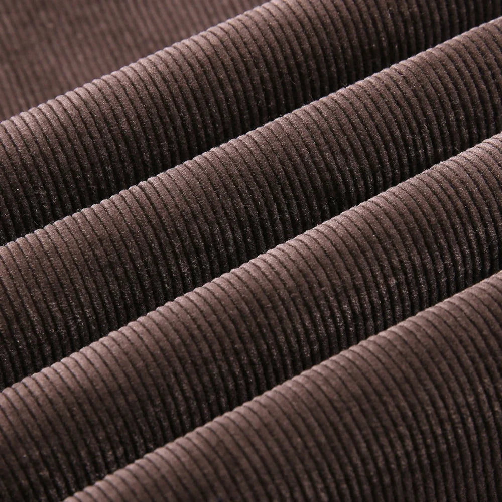 Close-up of classic textured denim fabric, highlighting quality and durable design of men's jeans.