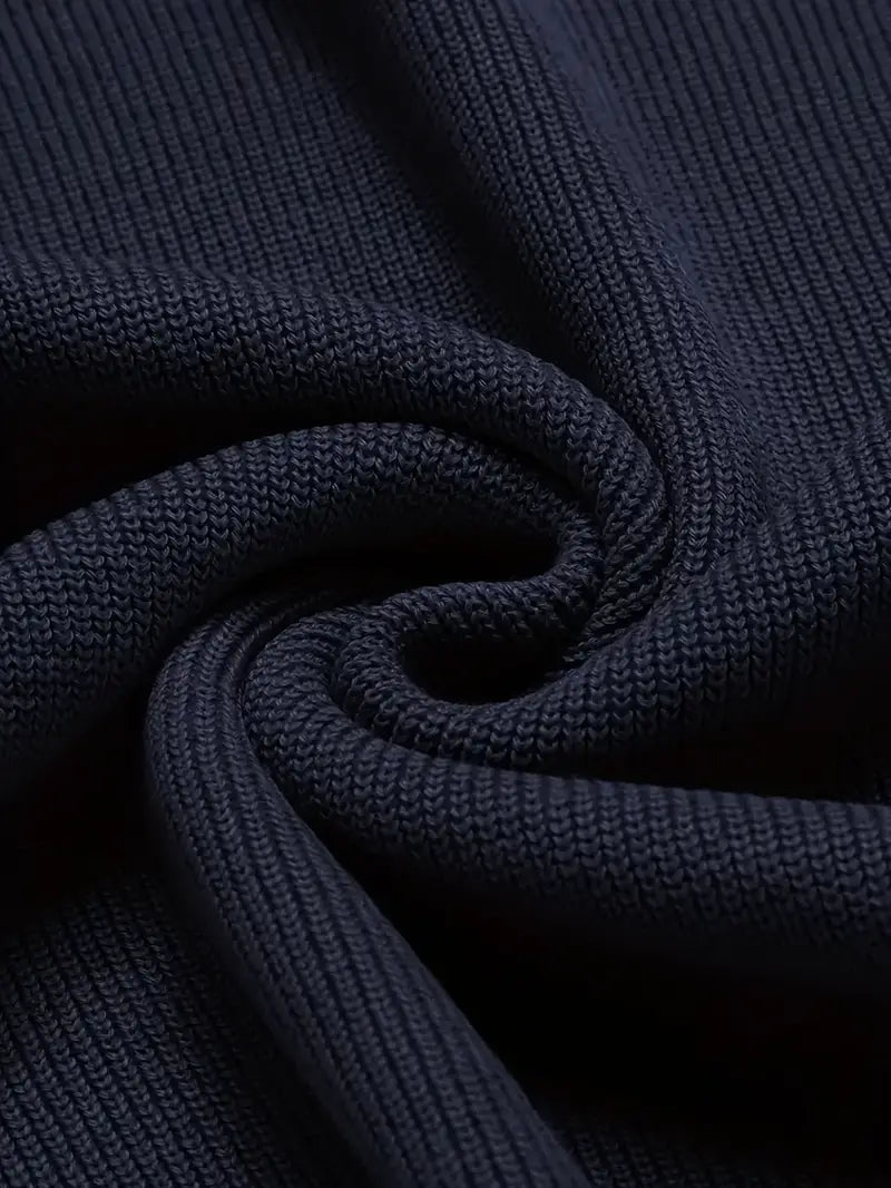 Close-up of a men's classic V-neck sweater in soft knit fabric, showcasing its texture and timeless quality.