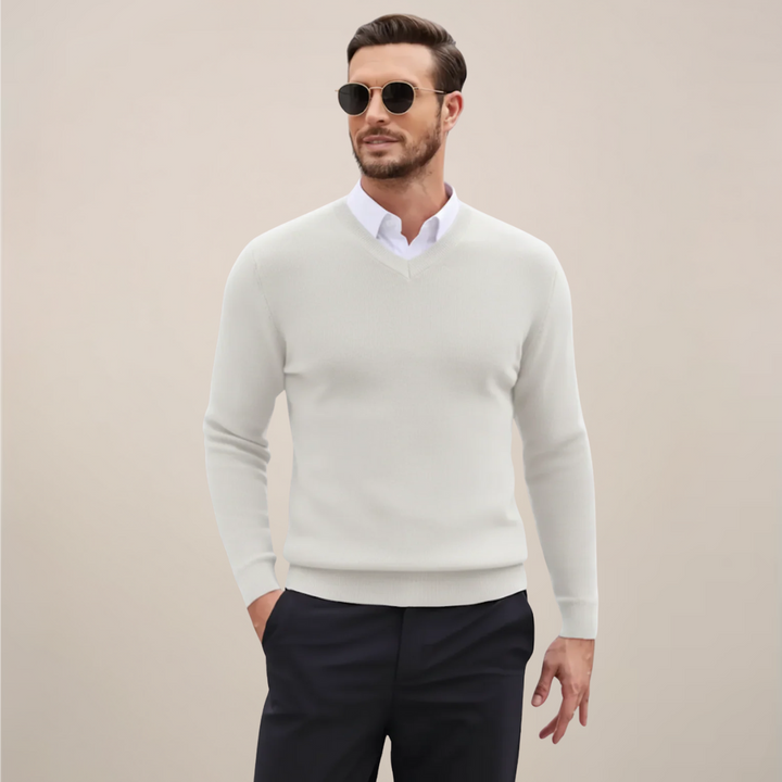 Man wearing a stylish men's V-neck sweater. Demonstrates the comfortable fit and classic look for modern mens fashion.