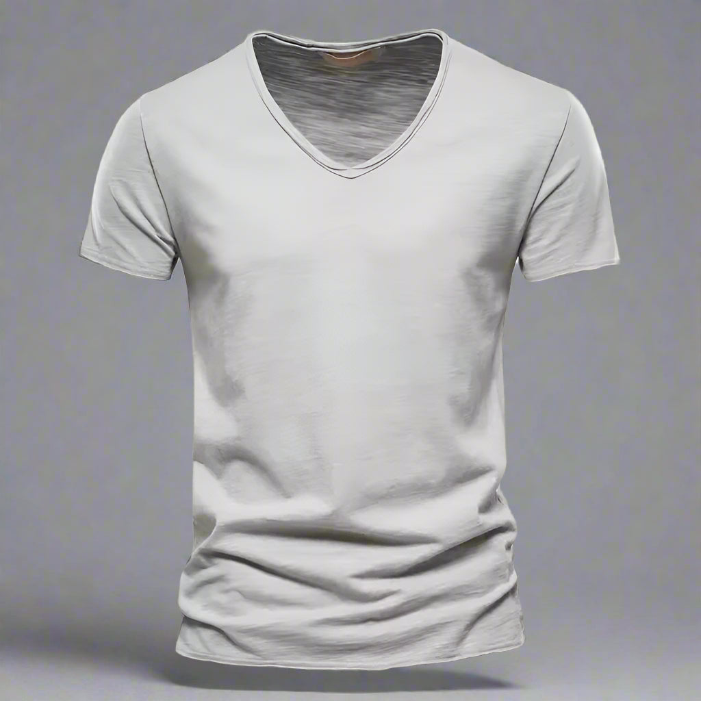 Close-up of soft fabric on a men's V-neck t-shirt. Breathable slim fit short sleeve casual top.