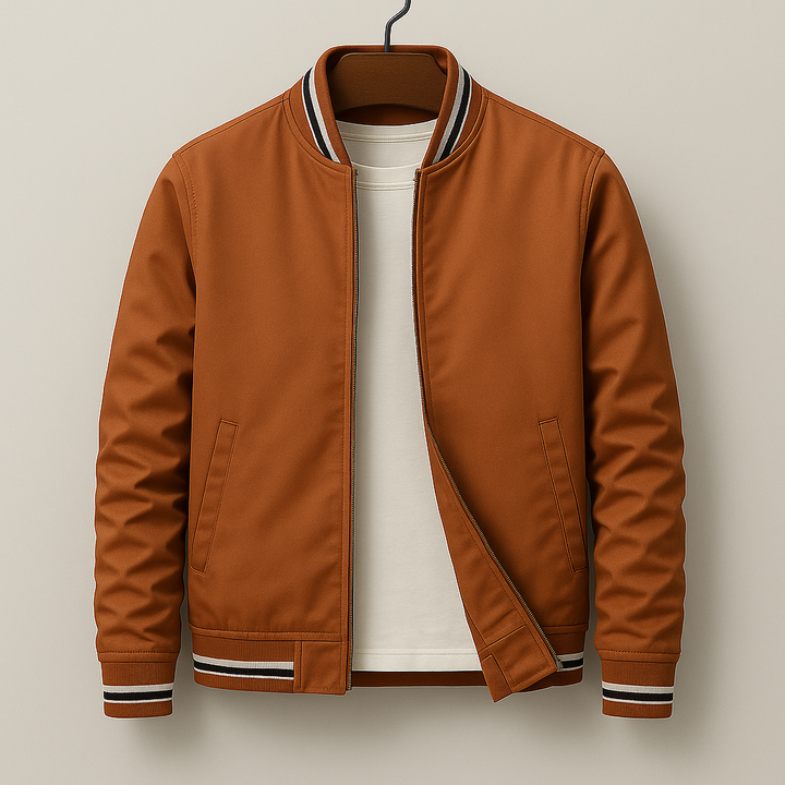 Young man posing in a classic men's varsity jacket, a stylish and comfortable bomber for everyday casual outerwear.