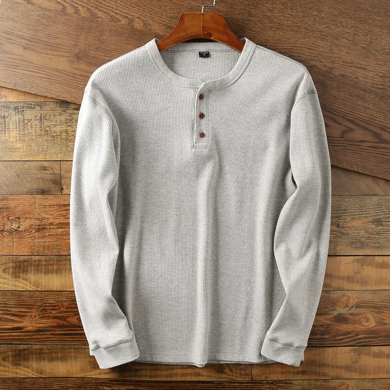 Soft, breathable men's waffle knit long sleeve shirt, perfect for casual layering or solo wear.