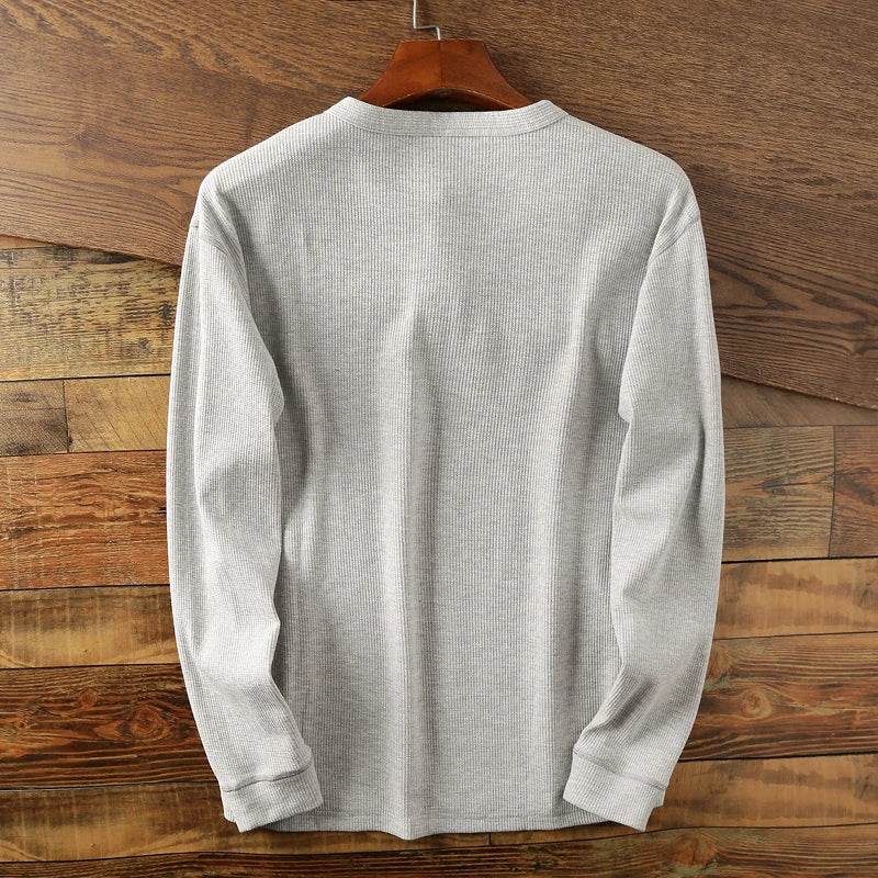 Classic fit men's long sleeve waffle knit shirt, a versatile and comfortable everyday top.