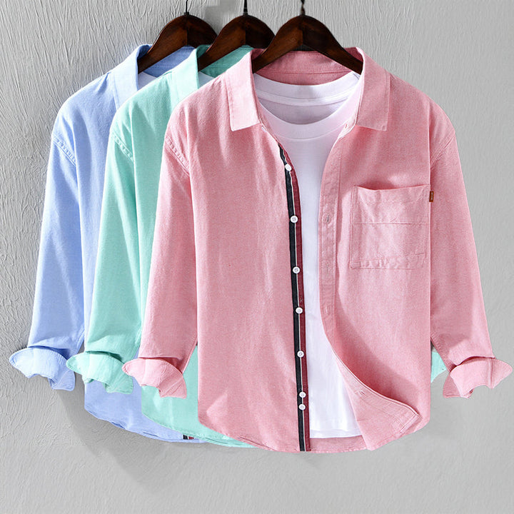 Comfortable men's long sleeve Oxford shirt with stylish ribbon trim. Versatile choice for everyday sophisticated wear.