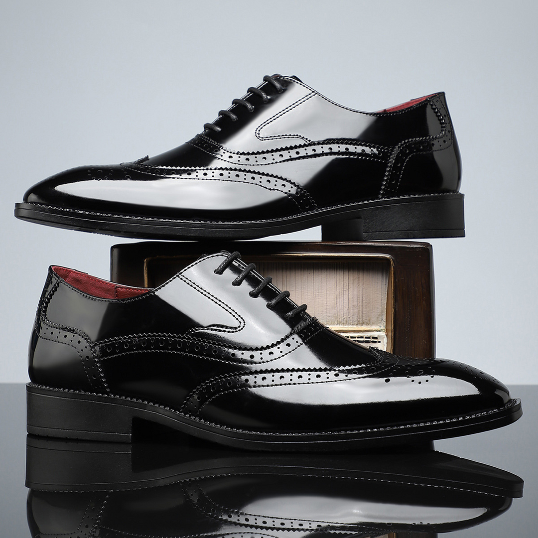 Side view of men's elegant wingtip brogue dress shoes with detailed craftsmanship.