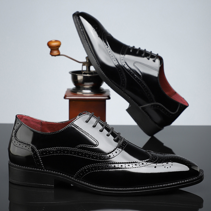 Men's black leather wingtip brogues, excellent for formal events and polished style.