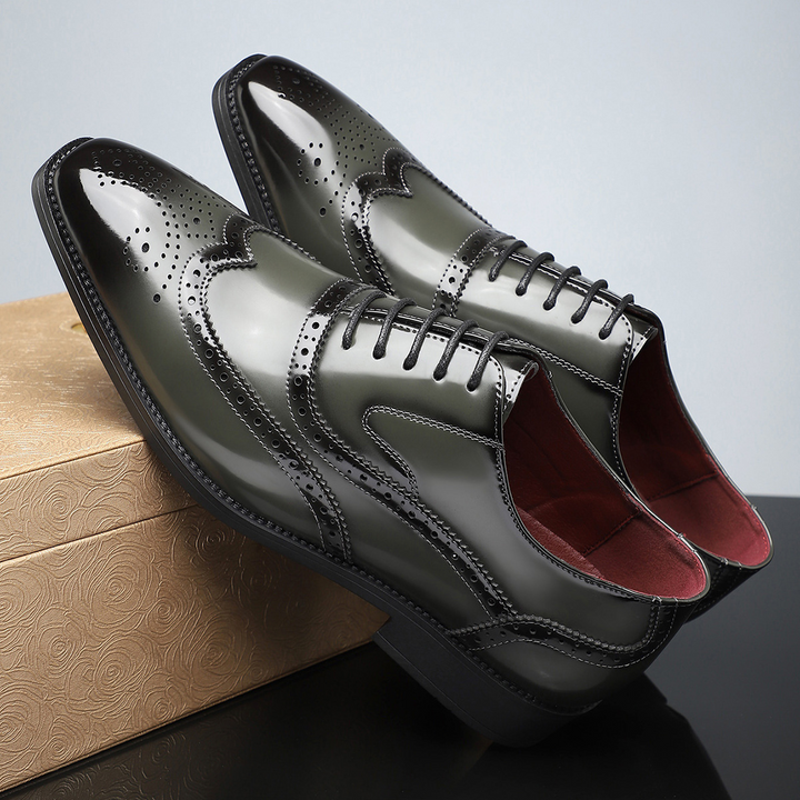 Detail shot of the perforations on men's classic wingtip brogue formal shoes.