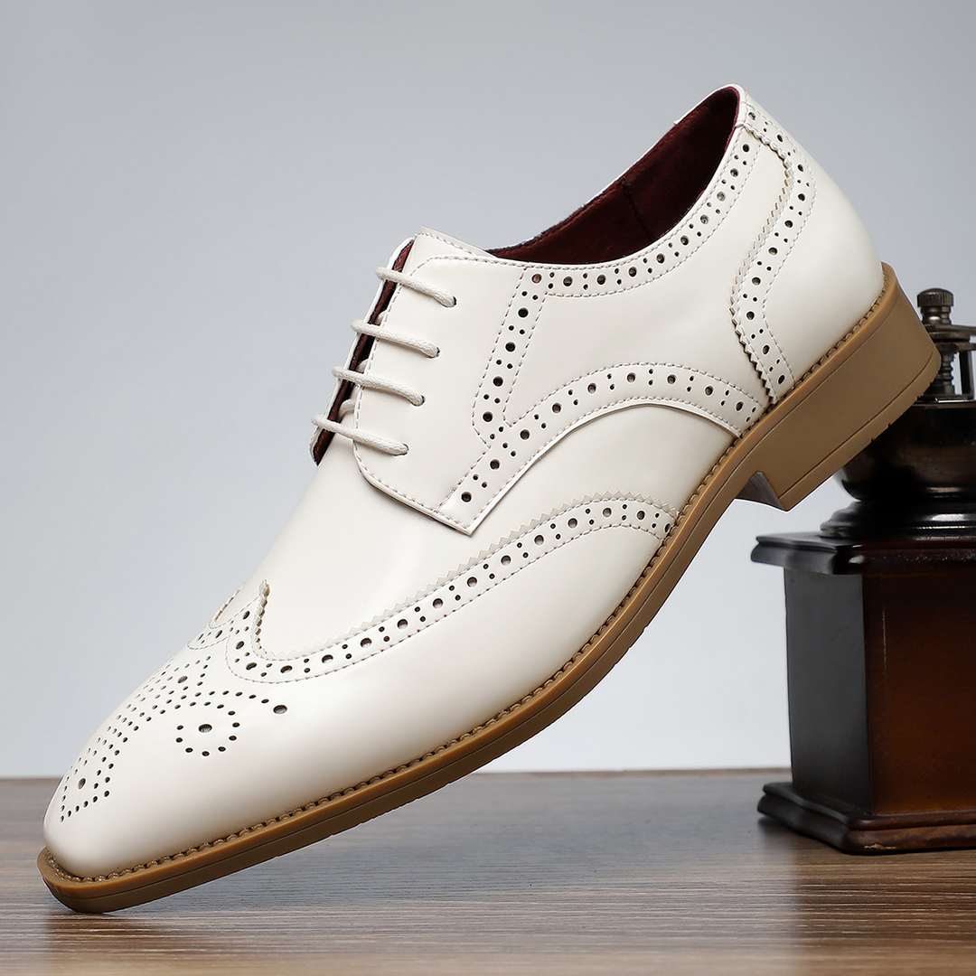 Men's polished brown wingtip brogues, perfect for adding a touch of class.