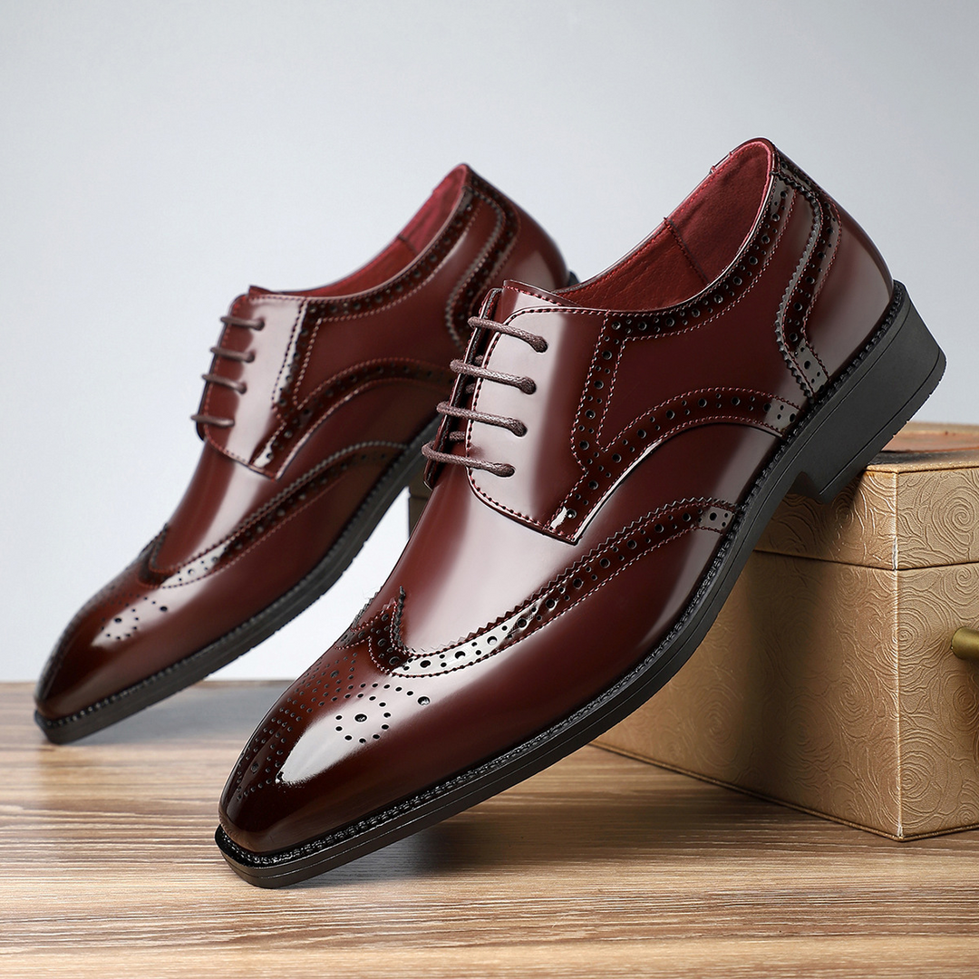 Sophisticated men's dress shoes featuring traditional wingtip and brogue design.