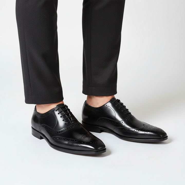Stylish men's handcrafted leather wingtip Oxford shoes in dark brown, a luxury footwear