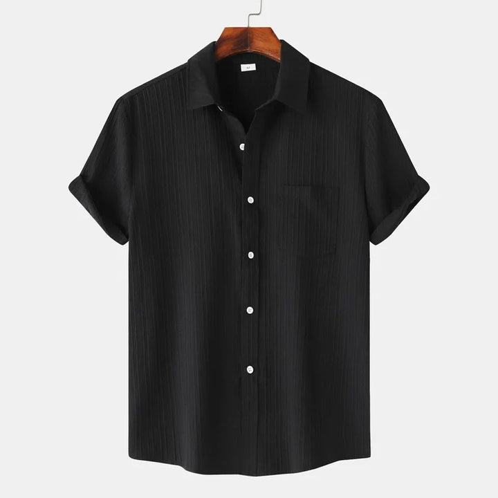 Men's Coastal Breeze button-up shirt. Lightweight & comfortable for summer beach days & travel.