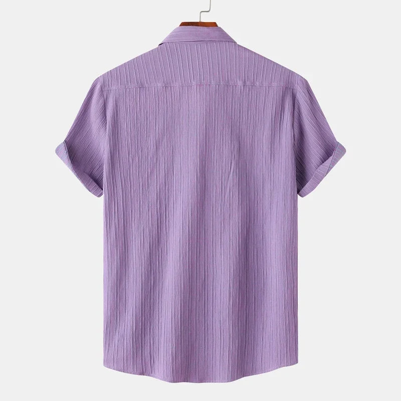 Breathable long sleeve men's button-up shirt with spread collar. Perfect for summer casual coastal fashion.