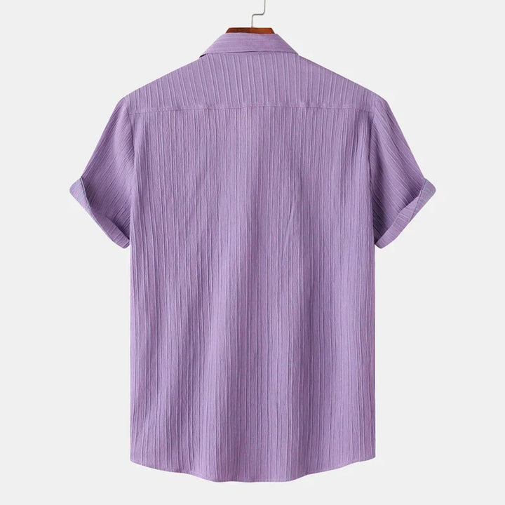 Breathable long sleeve men's button-up shirt with spread collar. Perfect for summer casual coastal fashion.