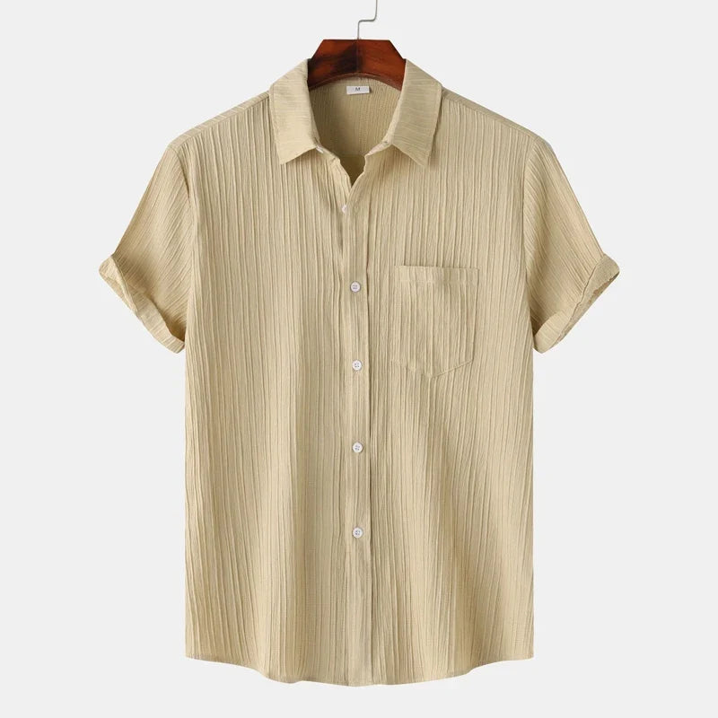 Men's long sleeve button-up shirt with spread collar. Ideal for summer coastal and relaxed casual styles.