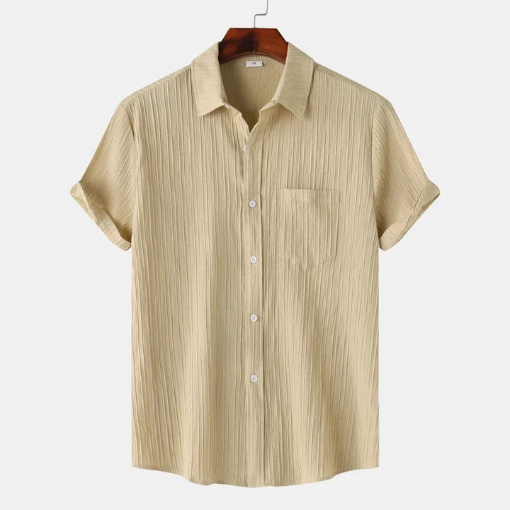 Men's long sleeve button-up shirt with spread collar. Ideal for summer coastal and relaxed casual styles.