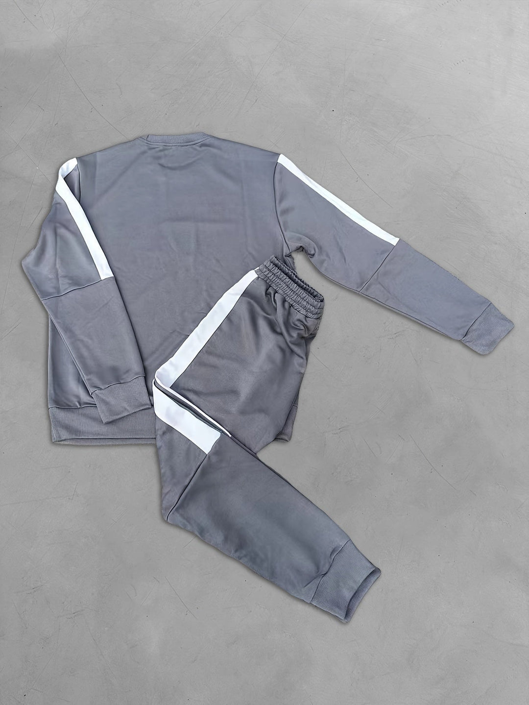 Trendy men's color block sport outfit, including a stylish sweatshirt and matching joggers.