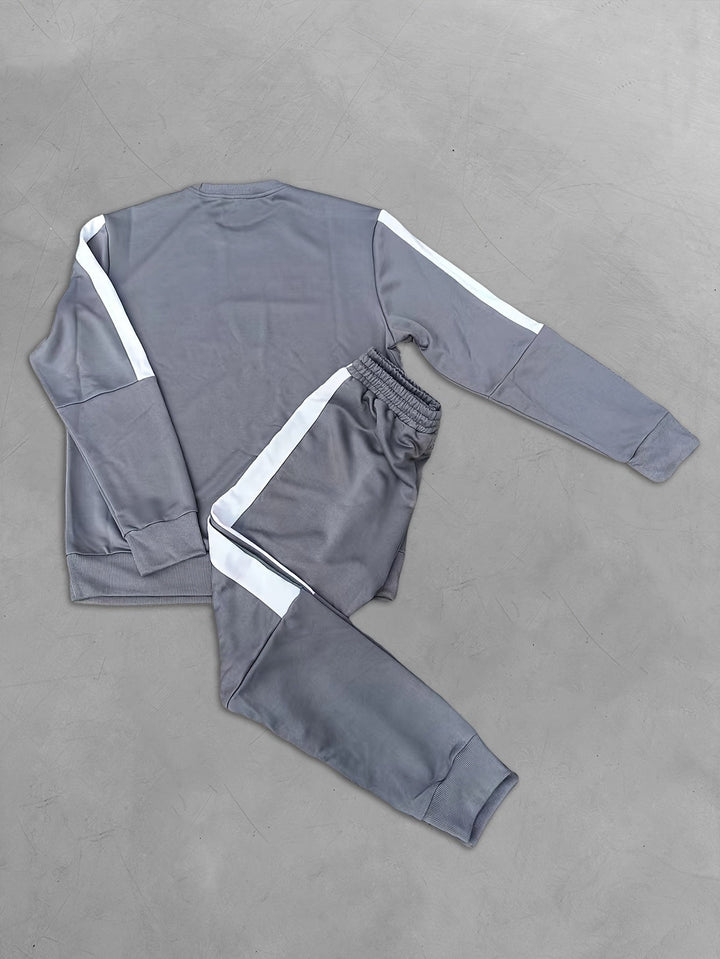 Trendy men's color block sport outfit, including a stylish sweatshirt and matching joggers.