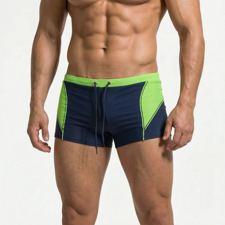 Modern color block men's boxer swim trunks, perfect athletic swimwear for beach or pool.