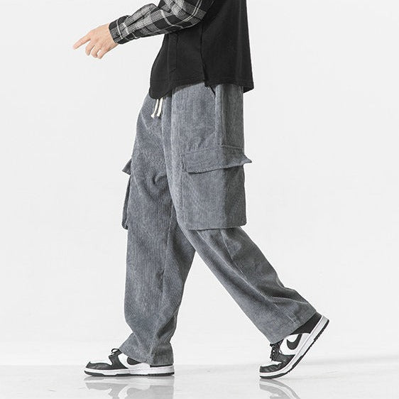 Side view of men's drawstring cargo pants, displaying functional utility pockets & comfortable fit.