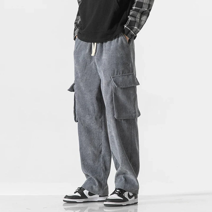 Relaxed fit men's cargo pants, featuring a convenient drawstring waist & multiple utility pockets.