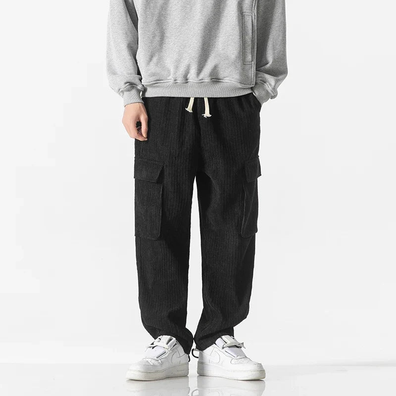 Stylish men's utility cargo pants with drawstring for a relaxed, modern fit and versatile look.