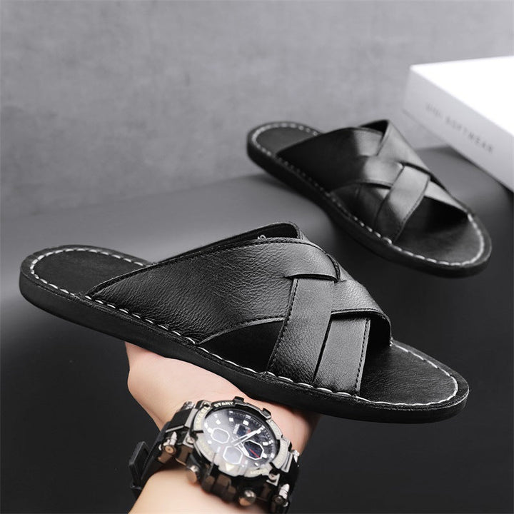 Men's cross-strap slide sandals, designed for comfort with an open toe and cushioned sole.